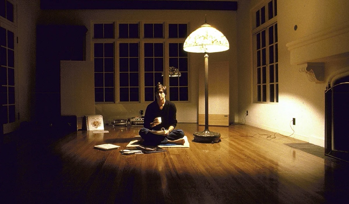 Steve Jobs sitting on the floor of his home, 1982